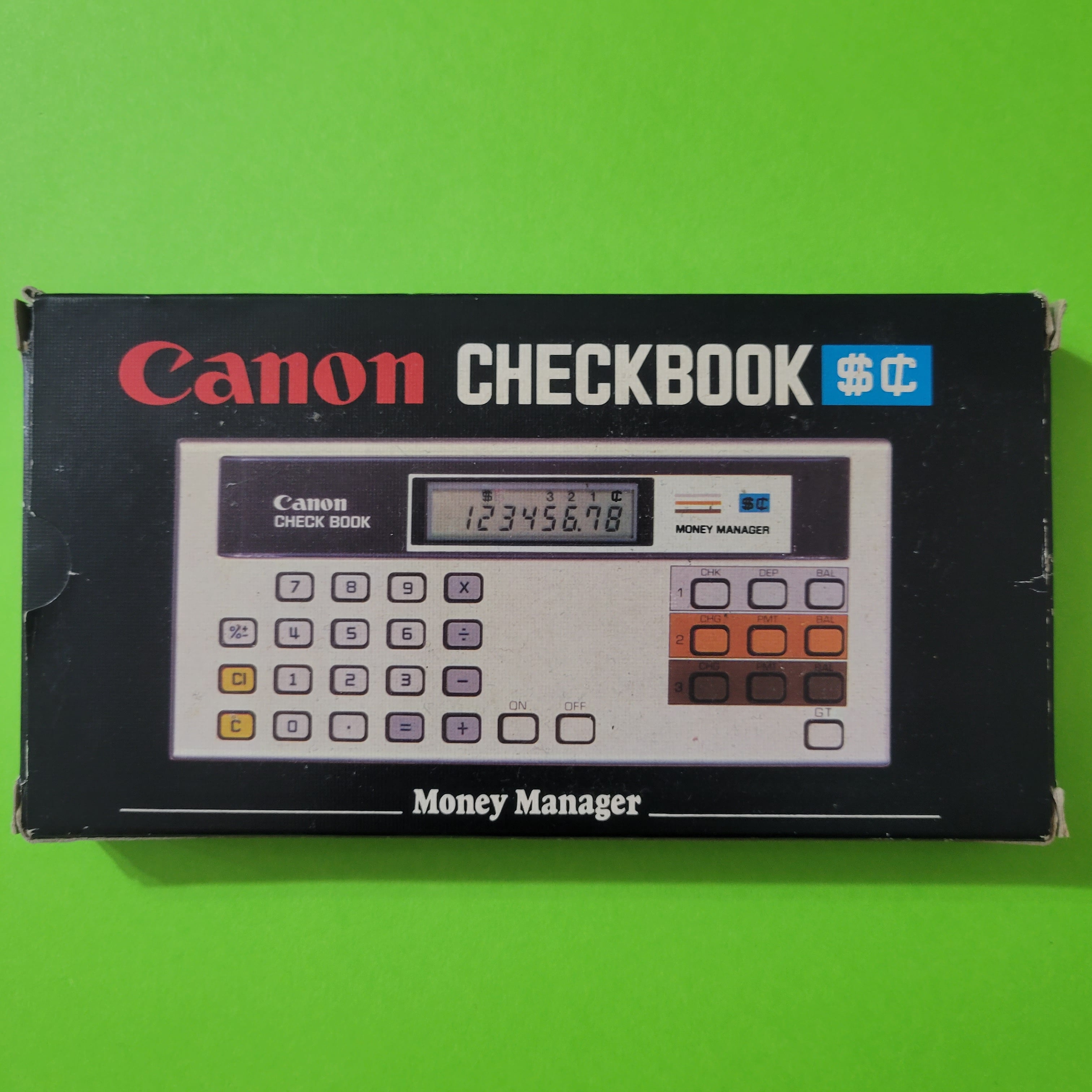 An image of the box of a Canon Checkbook EZ2-0014 financial calculator
